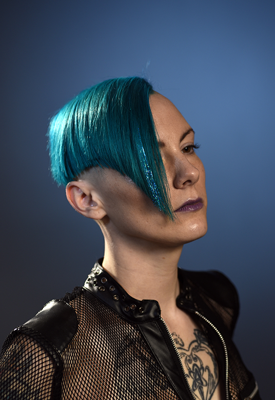 blue-green angled bob with shaved sides