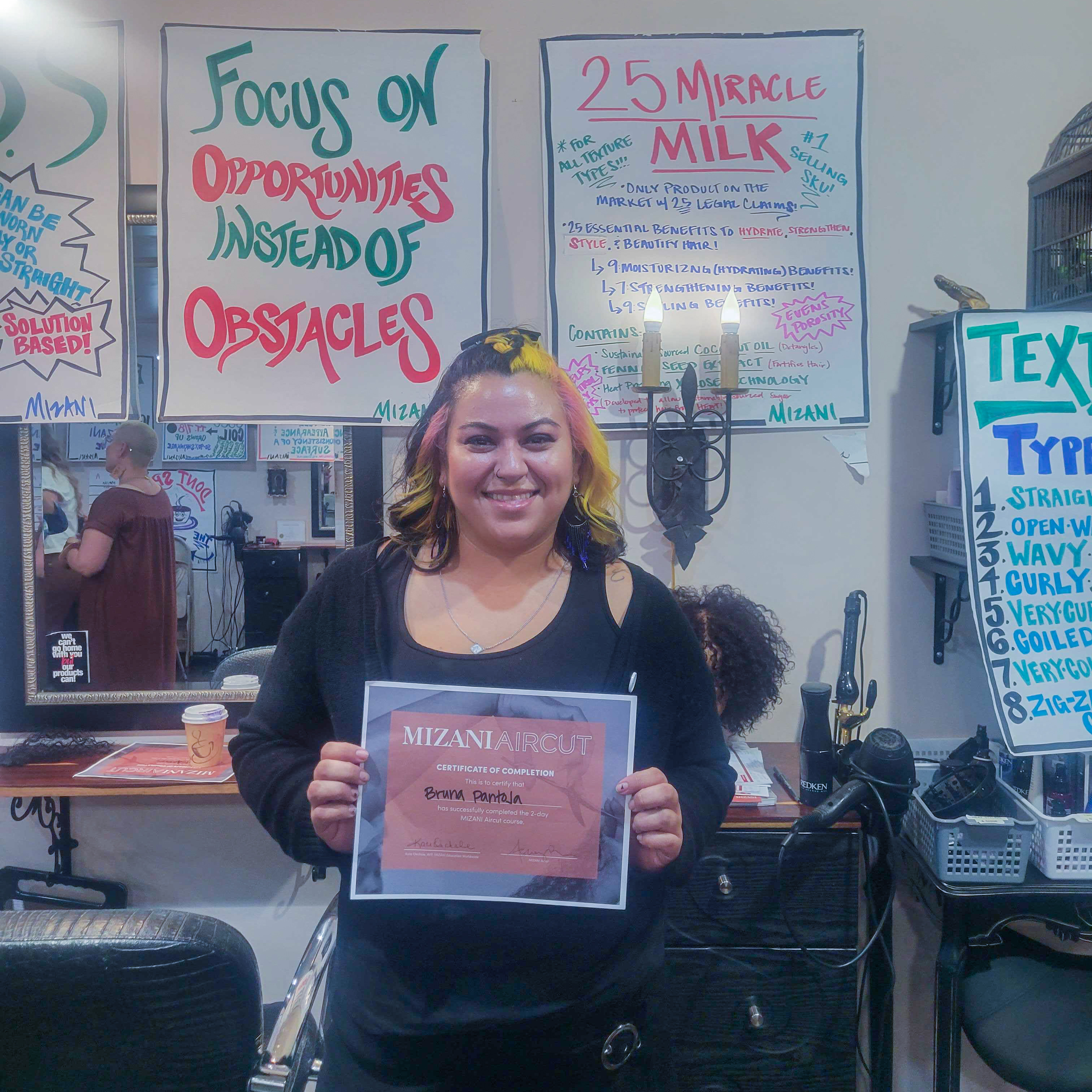 bruna pantoja holding a certificate of completion in a classroom